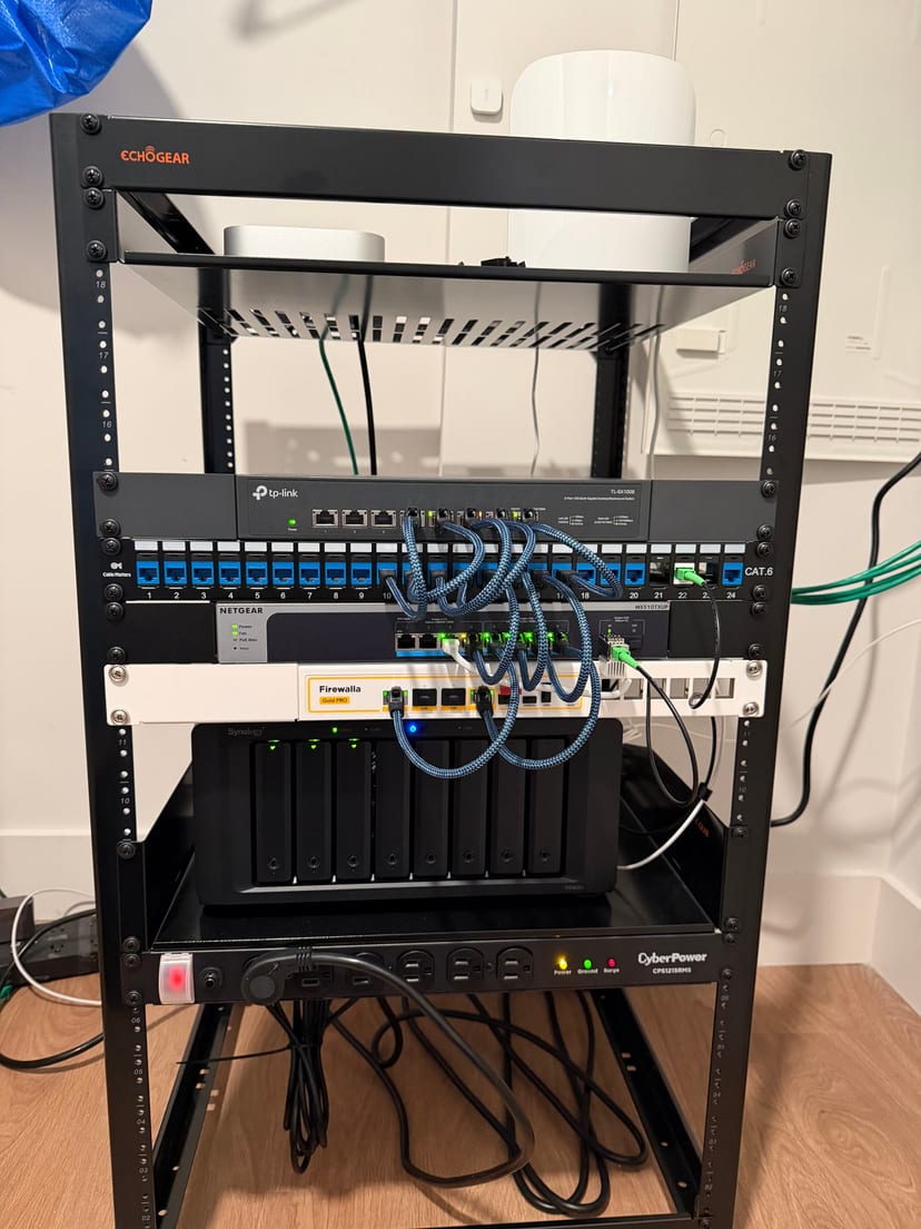 Main home server rack with networking gear, NAS, and rackmount power protection